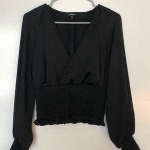 Smocked faux wrap black long sleeve top